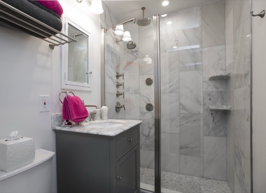 Marble-tiled shower enclosure with chrome fittings