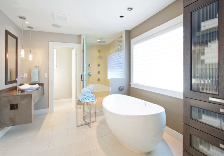 Modern bathroom with freestanding bathtub and tiled floor